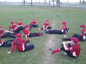 A picture of a Huntley Project Little League team warming up for a game at Worden's Hansen Park.  (Photo by Jonathan McNiven)