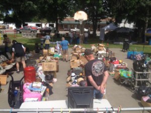 buyers at the Huntley Barkemeyer Park Auction are reviewing items to be bought before the auction started.  